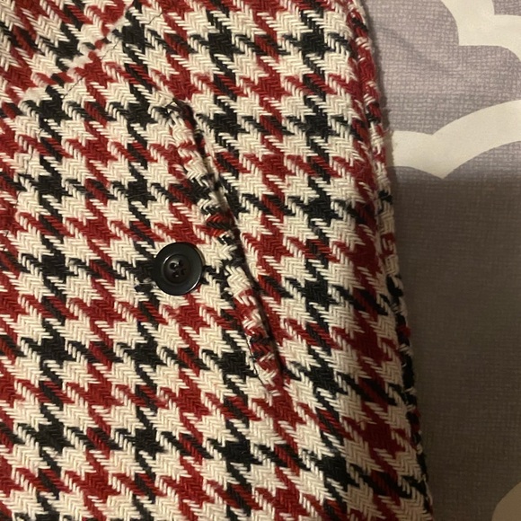 Cute plaid mini skirt with button embellishments and a zipper in the back. Small - Picture 3 of 6